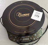 Top view of NuWave PIC Gold cooktop showing logo, surface, and control panel