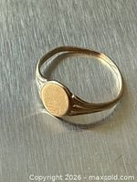 Ring on metal surface showing overall design