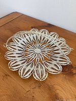 Top view showing full filigree basket and handle