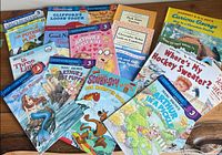 All 17 books spread on tabletop showing covers