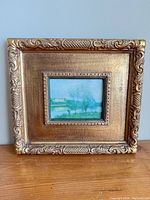 Front view of framed reproduction print showing artwork and frame