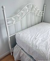 Full view of headboard and partial frame attached to mattress