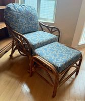Armchair and ottoman full view showing frame and cushions