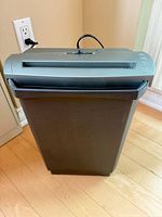 Front view of GBC CC55 shredder with wastebasket attached