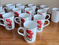 Group of bone china mugs, both poppy and textured styles visible