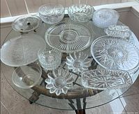 All fifteen glass pieces laid out on table
