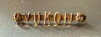 Front view showing YUKON letters and gold nuggets