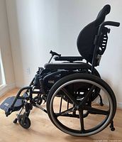 Right side view of Quickie 2 wheelchair showing black frame, Matrx backrest, ROHO cushion, 24-inch grey-trim wheel, footrest