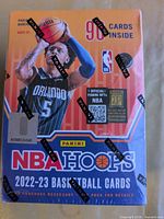 Front of sealed NBA Hoops 2022-23 blaster box showing Paolo Banchero, 90 cards inside text, Panini logos on shrinkwrap