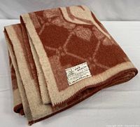 Folded blanket showing overall color and texture with label visible