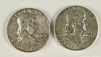Obverse of both Franklin half dollars showing dates 1962-D and 1963-D