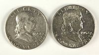 Obverse of both Franklin half dollars, dates 1951 and 1962-D visible