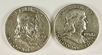 Obverse view of both Franklin half dollars showing dates 1957-D and 1958-D