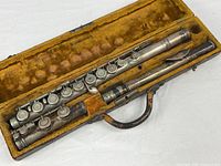 Full view of flute disassembled in lined case