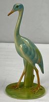 Full view of ceramic crane figurine on base