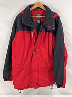 Full front view of red and black L.L.Bean jacket on hanger
