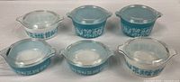 All six Pyrex Butterprint covered casseroles grouped