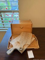 Group shot of bread box, tray, and two cutting boards