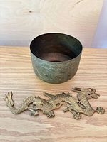 Bowl upright with dragon plaque in foreground