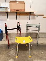 Three mobility aids: rollator, walker with tray, shower stool