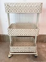Front view showing three lattice trays and casters