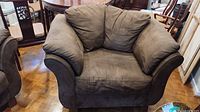 Full front view of brown ultrasuede armchair