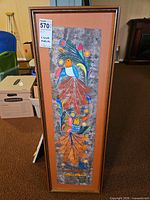 Full front view of framed painting showing entire artwork, mat and frame