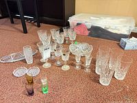 Group of all crystal and glass pieces on floor