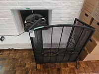 Insert and screen positioned at fireplace opening