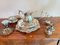 Group shot of all silver plated items on sideboard