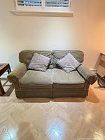 Front view of loveseat with two pillows
