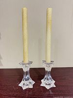 Front view of both crystal candlesticks with candles inserted