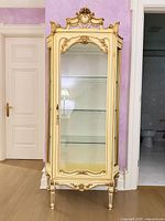 Full front view of curio cabinet showing overall design and condition