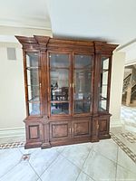 Front view showing full china cabinet with upper glass hutch and lower base