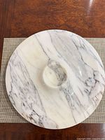 top view of round marble platter showing veining and central well