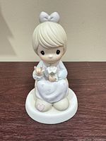 Front view of Precious Moments figurine showing full details