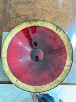 Top view showing red marbled interior and gold rim