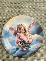 Front view of Angel of Grace plate showing artwork and gilt rim