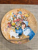 Front view of plate showing complete artwork and gold rim
