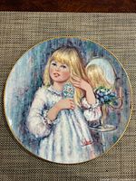 Front view of plate showing artwork and gold rim