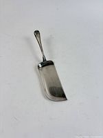 Full view of sterling silver crumb scoop
