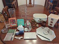 Overall lot view on dining table showing all items