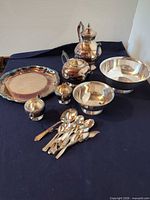 All silver-plated serveware, tray, bowls, teapot, coffee pot, sugar and creamer shown together