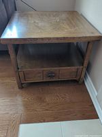 front view showing top, drawer, shelf, wood grain