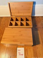 Two bamboo tea boxes shown, one open displaying 9 compartments, one closed