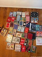 Overhead view of entire assortment of boxed decks laid out on wooden floor
