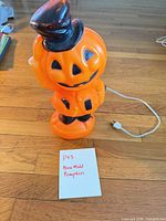 Full view of pumpkin blow mold with power cord visible