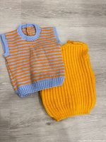 Front view of both knitted sweater vests