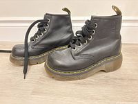 both boots side view showing profile, leather, yellow stitching, platform sole