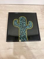 Full view of framed cactus artwork